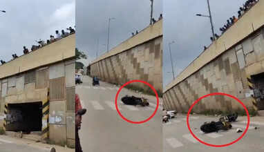 சாலையில் வீலிங் செய்த இளைஞரின் பைக்கை பாலத்தில் இருந்து கீழே தூக்கி போட்ட பொதுமக்கள்